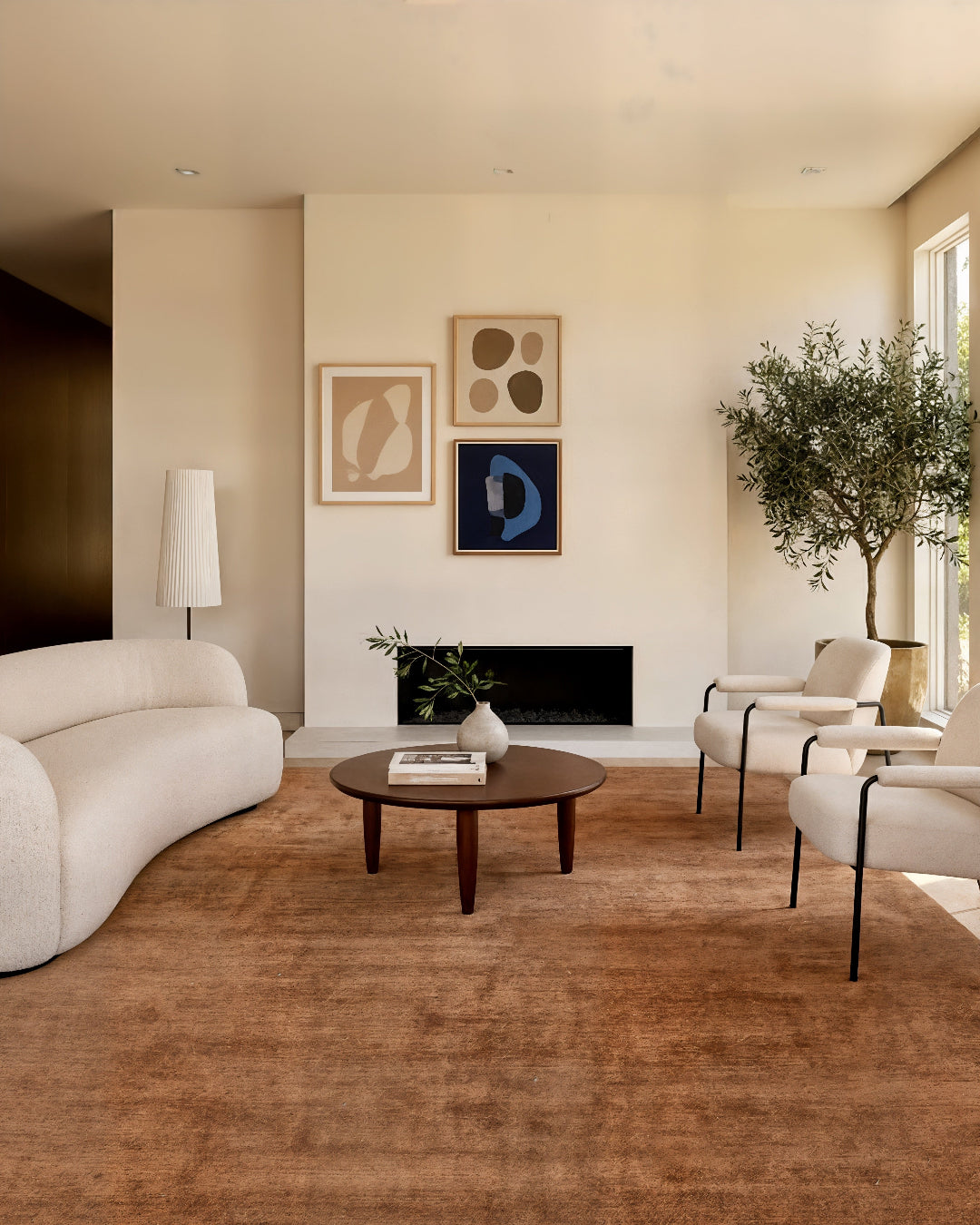 Modern living room with beige sofa, wooden coffee table, and decorative elements.